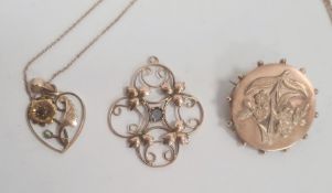 Gold, ruby and pearl heart-shaped pendant, floral design and pierced, on fine chain, a 9ct gold