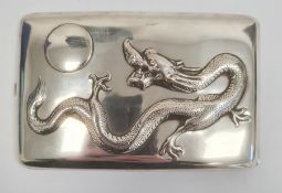 Chinese silver cigarette case, rectangular and curved, the hinged lid repousse with dragon chasing