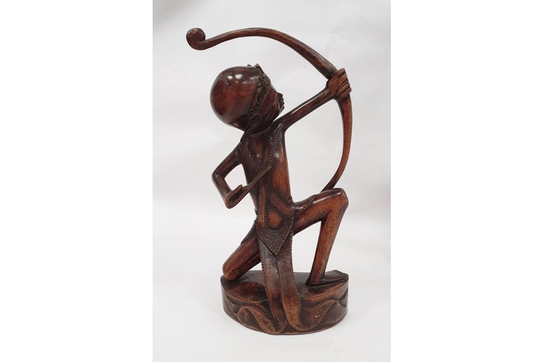 Assorted 20th century Eastern carved figures to include figure in hat carrying jug and basket, - Image 2 of 9