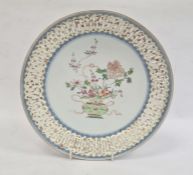 Chinese porcelain shallow dish with pierced border, the centre painted in enamel with