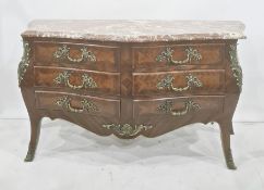 Reproduction walnut commode of serpentine form, fitted with six short drawers, with gilt metal