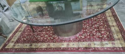 Red ground Kashmiri rug, allover floral decoration with gold border, 240 x 160cm