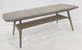 Dark elm Ercol coffee table with magazine rack under, 105cm x 36.5cm Condition ReportNumerous