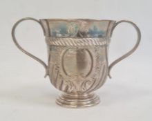 A Victorian silver two-handled trophy cup, central blank cartouche, semi-gadrooned, on circular
