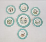 French pottery nursery set of six tea plates and one larger bread and butter plate, all variously