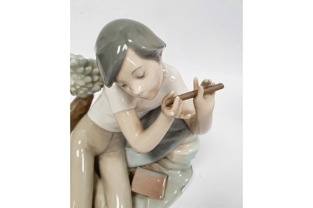 Lladro porcelain figure of boy with flute, 20cm high and another of girl seated with lamb (2) - Image 2 of 10