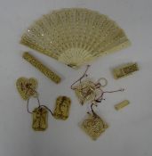 A Chinese ivory needle case (missing lid), relief detail of peacock and dragon, a miniature ivory