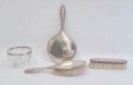 Silver three-piece dressing table set, Birmingham 1916, comprising hand mirror and two brushes,