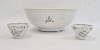 Chinese style porcelain punch bowl painted with small floral spray and having blue and gilt borders,
