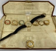 A Nivada watch face with six other watch face surrounds in Nivada Colorama VII bag and a Seiko