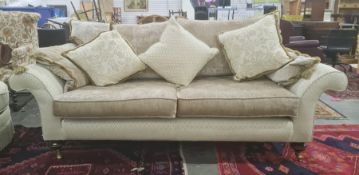 Lee Longlands three-seater sofa and matching chair in diamond-patterned upholstery, with brown