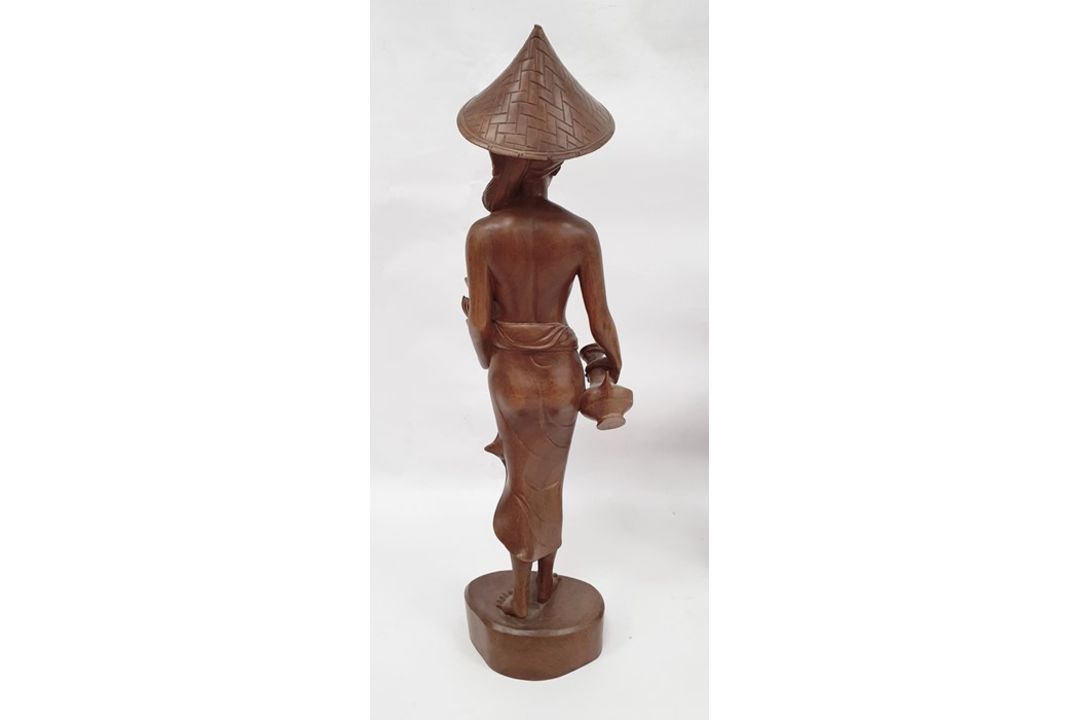 Assorted 20th century Eastern carved figures to include figure in hat carrying jug and basket, - Image 4 of 9