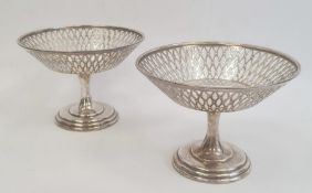 A pair Asprey & Co. silver pedestal bonbon dishes, pierced bowls on circular bases, Birmingham 1915,