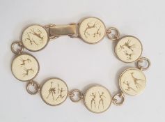 South African 9ct gold and ivory bracelet, seven circular ivory mounts depicting hunting scenes,