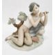 Lladro porcelain figure of boy with flute, 20cm high and another of girl seated with lamb (2) - Image 1 of 10