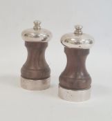 Pair of turned wooden pepper grinders with silver mounts by M C Hersey & Son Ltd, London 1993,