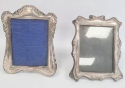 Edwardian silver mounted photograph frame, rectangular with scroll and floral repousse detail,