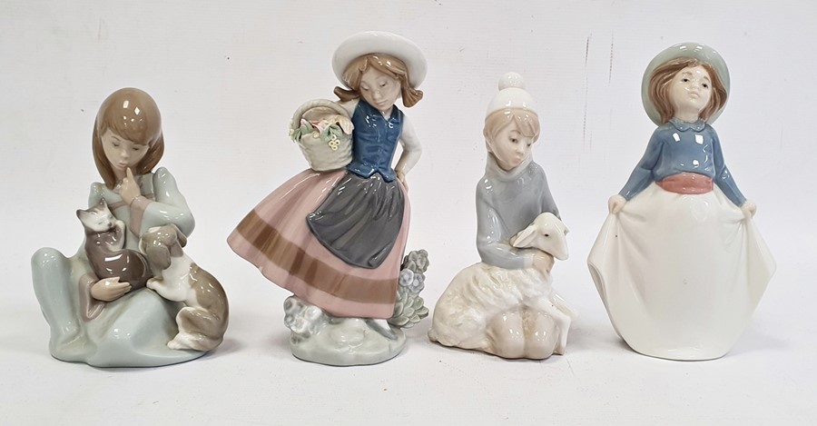 Lladro group of girl washing a dog, another model of rabbit, another cow, seated and swan with