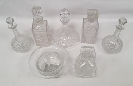 Assorted decanters and pedestal bowl with grape and vine decoration, square base
