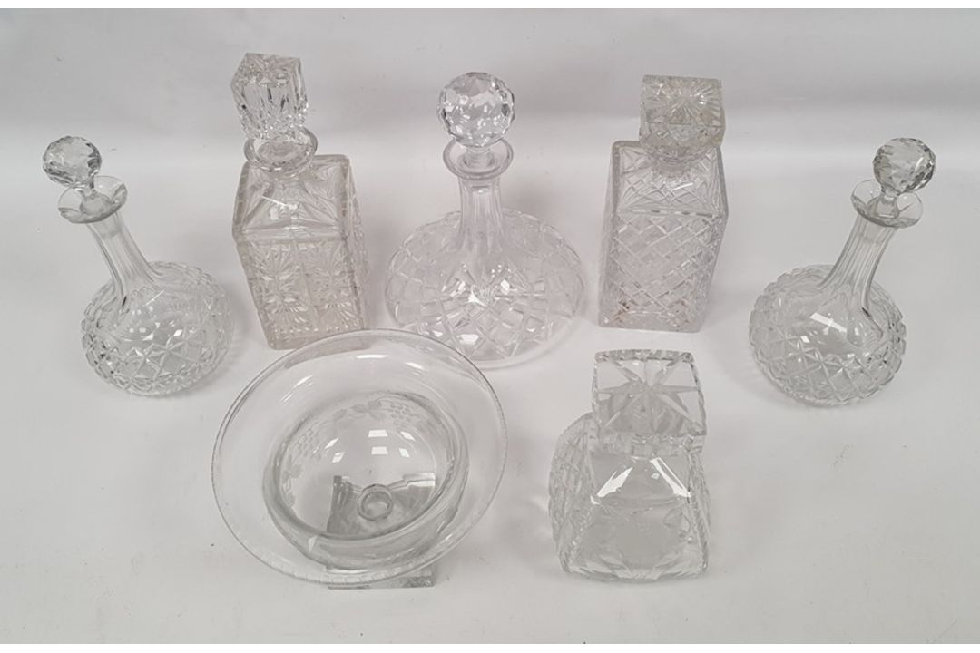 Assorted decanters and pedestal bowl with grape and vine decoration, square base