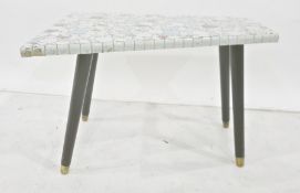 Mid 20th century tile pebble top shaped coffee table on four ebonised supports, to brass caps,