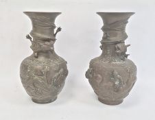 Pair Chinese bronze vases, baluster-shaped and each embossed with pair dragons and flaming pearl and