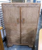 1930/1940's limed oak compactum with carved floral and scroll frieze over two doors with chrome