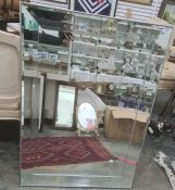 Modern rectangular wall mirror of plain form with bevelled panels, 76 x 107cm