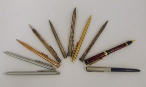 Assorted white metal propelling pencils and pens, etc