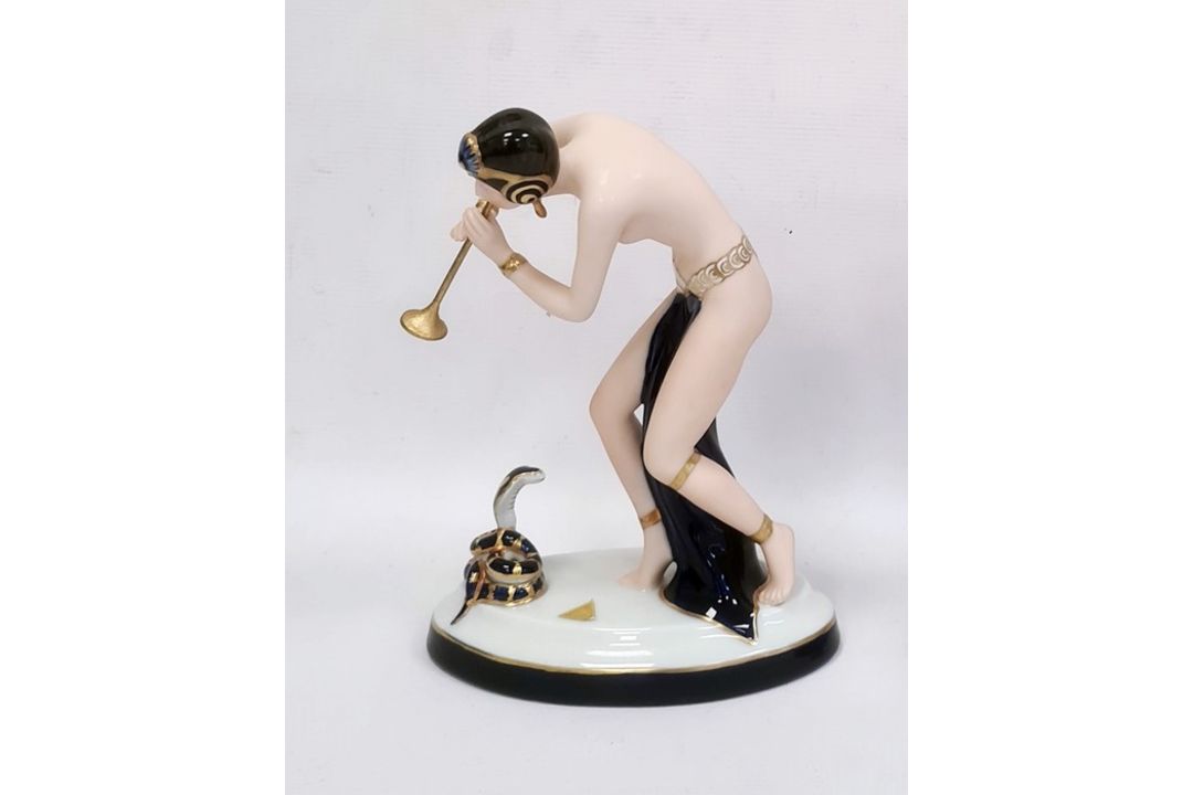 Royal Dux tinted bisque and glazed porcelain figure of a semi-nude snake charmer, on oval base, 23. - Image 1 of 6