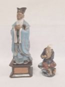 Chinese tinted bisque and partly glazed figure of a sage in blue robes and on square ceramic