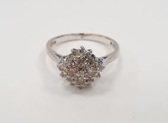 18ct white gold diamond cluster ring set with four brilliant cut diamonds within a border of further