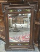Late 19th century Aesthetic movement mirror, the rectangular plate flanked by hand painted floral