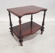 Victorian mahogany serpentine-fronted two-tier etagere on turned, fluted and carved supports, turned