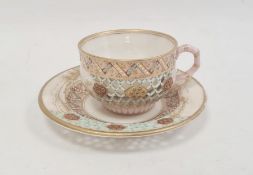 Royal Worcester porcelain reticulated cabinet cup and saucer with gilt landscape and jewelled