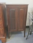 19th century mahogany cupboard, the square top above two-panelled door opening to reveal shelves, on
