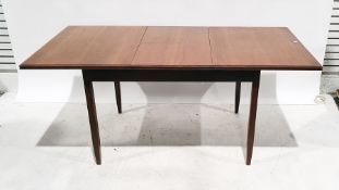 Mid century White & Newton teak extending dining table of rectangular form, on square section