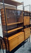 Ladderax lounge unit consisting three uprights, sliding glass unit, three drawer unit, secretaire