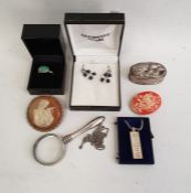 Silver ingot pendant on chain, a white metal box of oval form with hinged cover decorated with a