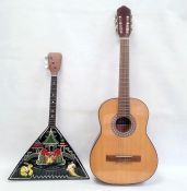 Eastern European painted balalaika with triangular-shaped body, inscribed 'Kohek-Hpnyhok 1903(?)'