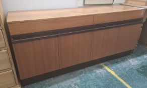 Possibly 1980's G-Plan teak sideboard, the rectangular top above two drawers and four cupboard