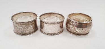 Silver napkin ring and a pair of silver plated napkin rings