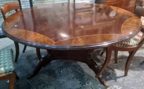 20th century mahogany and strung circular dining table, ogee mould edge, on four turned column