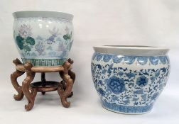 Two Chinese porcelain jardinieres, 20th century, the first decorated in blue in the Ming style