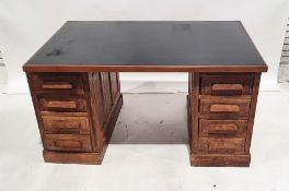 20th century oak pedestal desk raised on plinth base, 138.5cm wide
