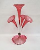 Cranberry and clear glass epergne with central flared trumpet vase, having surround of three