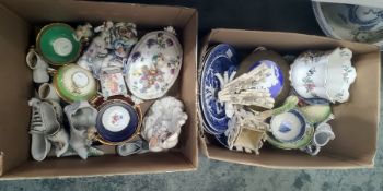 A continental porcelain two-handled tureen and cover of oval form, painted with flowers and