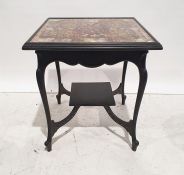 Late Victorian side table, the top decorated with cigar papers, on ebonised base, 66cm wide
