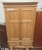20th century pine wardrobe with moulded cornice above two drawers, on plinth base
