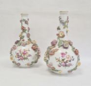 Pair of Dresden bottle vases, circa 1900, printed AR Dresden marks, painted with scenes of lovers in